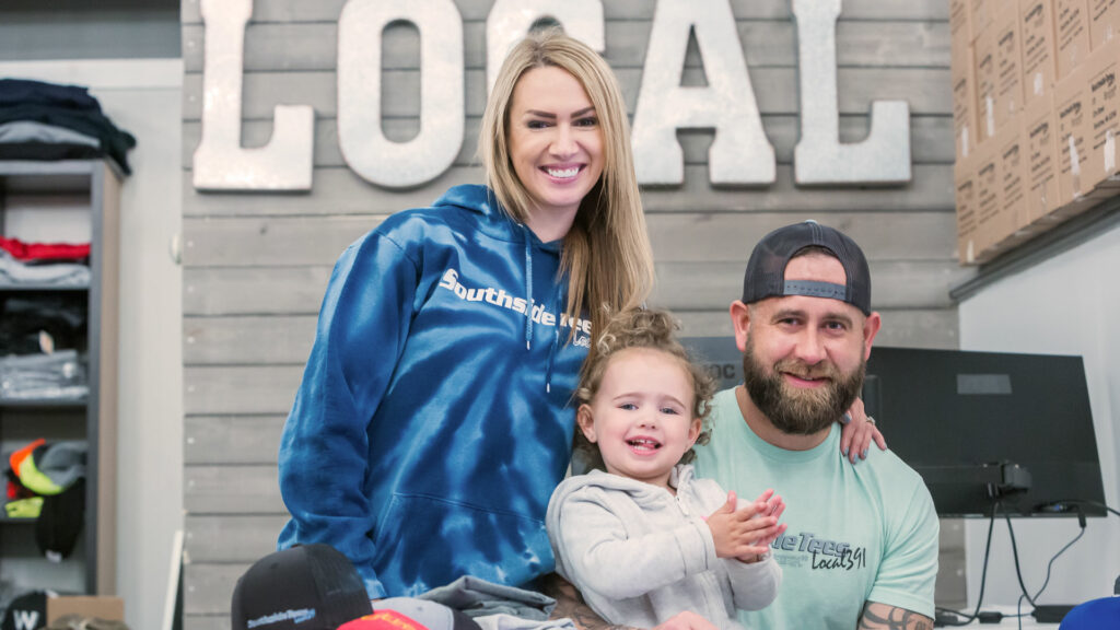 Sean Conroy, owner of South Side tees along with his wife and daughter.